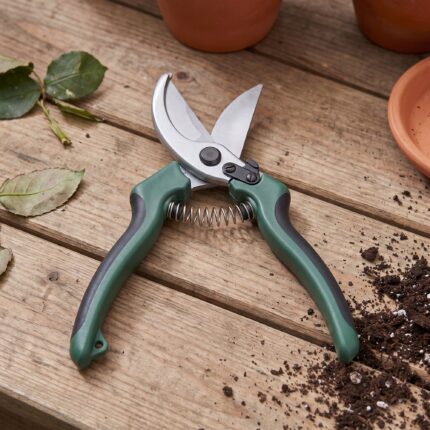 Fieldstone hand pruner open from above showing the spring and safety catch