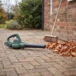 Gustwind leaf blower on a swept patio with leaves gathered into a pile