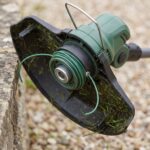 Close-up of the Trailhead trimmer head, guard and nylon cutting line